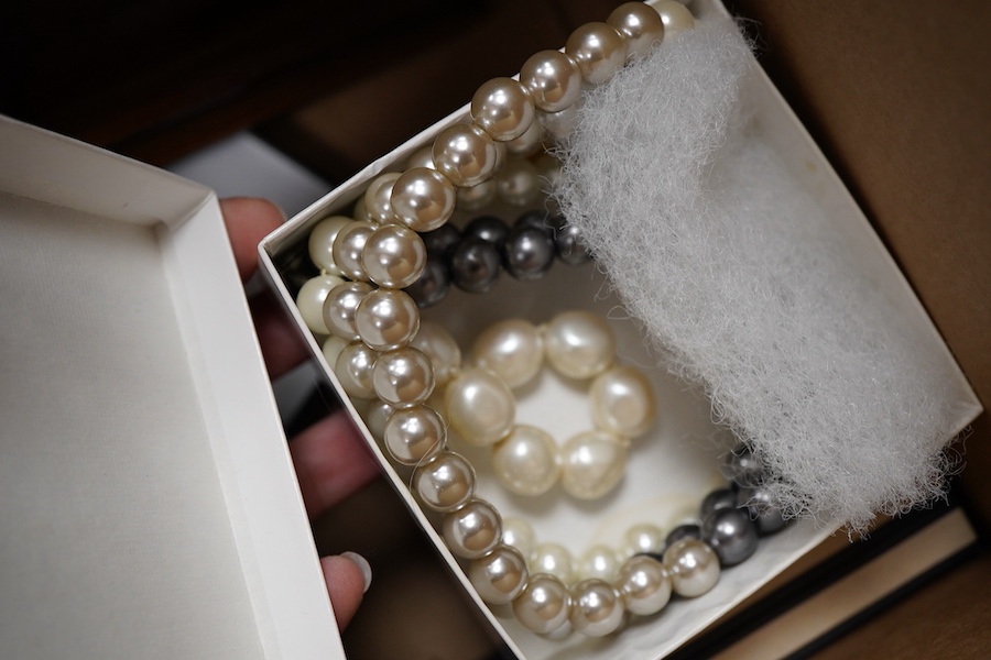 A cultured pearl necklace, composed of graduated cultured pearls of pale pink tint measuring approximately 11-12mm, to a spherical clasp stamped 14K; a black opal measuring approximatley 11 x 7mm, on a display cushion; a